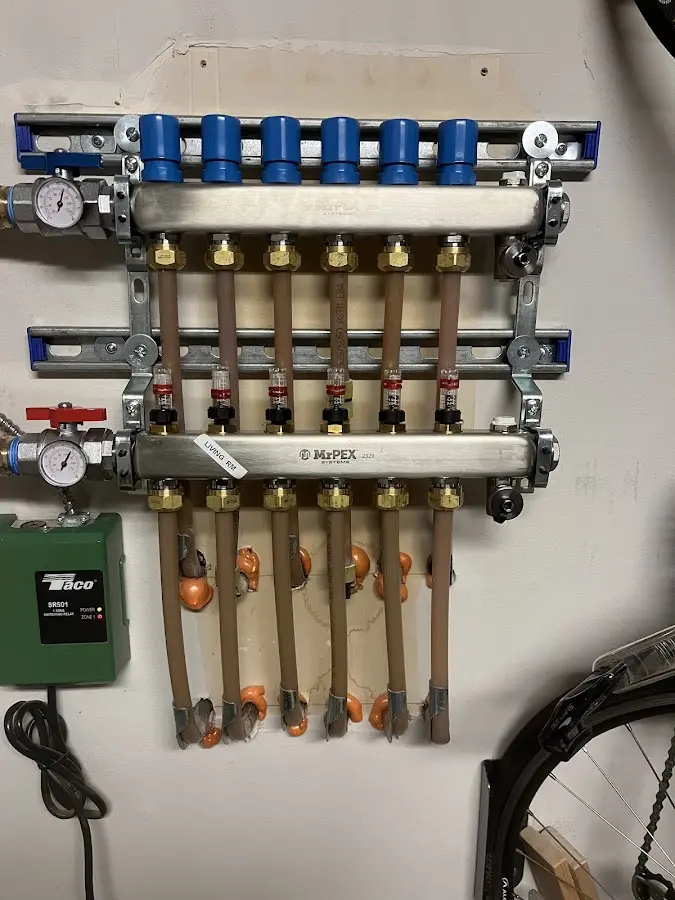 Plumber performing Water Heater Repair at a residential property in Walled Lake